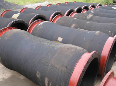 Many silt dredge hoses are on the ground